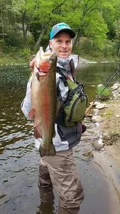 Photograph of a rainbow trout, a 24-inch fish caught while fishing in New Hartford