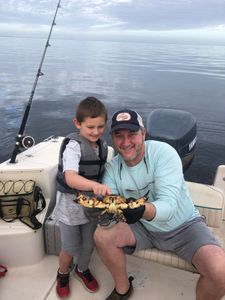 Two anglers fishing on a boat in Florida