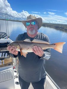 Angler holding a redfish in Tallahassee