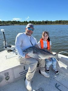 Angler with a big black drum fish caught in St. Bernard