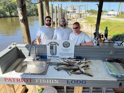 Three people fishing at St Bernard