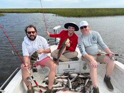 Two redfish and sheepshead, 14 inches, caught while fishing in LA