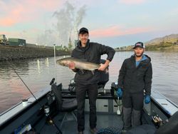 Two people fishing in Kennewick with one catch