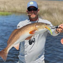 A lone angler reeling in a big catch in St Marks