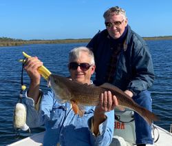 Angler with a large redfish caught while fishing in Florida