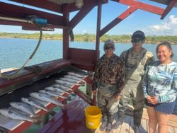 Two anglers fishing with rods in Arroyo City