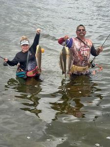 Two anglers with fishing rods in TX