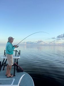 Fisherman standing by the water in Arroyo City