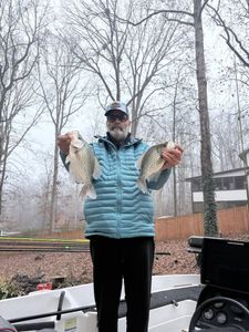 Two crappie fish caught while fishing in Cumming GA displayed on boat