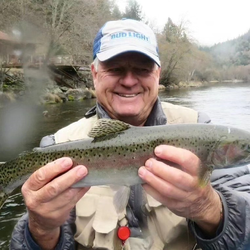 Angler catches a rainbow trout in CA
