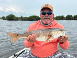 Photograph of a 22-inch redfish caught while fishing in FL
