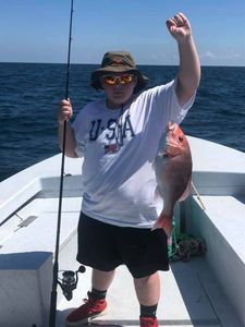 A single fisherman at Orange Beach