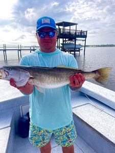 A person fishing with a rod at Orange Beach