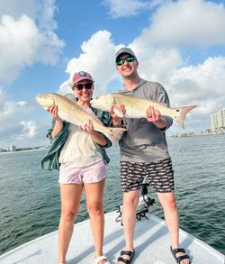 Two redfish caught during fishing charter in Orange Beach Alabama