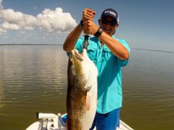 A lone angler reeling in a 23-inch catch in Florida