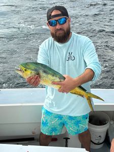A fisherman reeling in a catch in DE