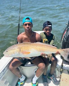 Anglers with rod catching fish in SC