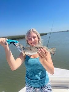 Angler fishing with rod and reel in scenic Mount Pleasant