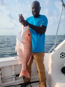 A lone angler reeling in a 28-inch catch in SC