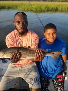 Redfish caught by two anglers in Mount Pleasant