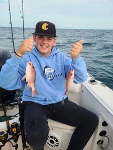 Two fish caught by a person in Mount Pleasant