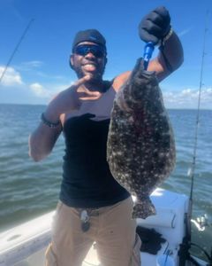 Photograph of a Summer Flounder, a 25-inch fish caught while fishing in Mount Pleasant.