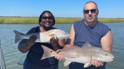 Two huge redfish caught on fishing trip in Mount Pleasant