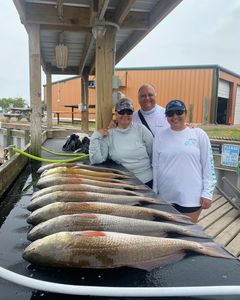 A group of 3 people fishing in TX