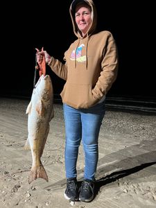 A person fishing on the Bolivar Peninsula