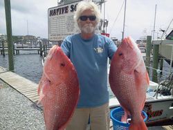 Angler fishing in Pensacola with 2 big fish