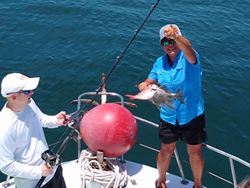 Two anglers with a fishing rod in Pensacola