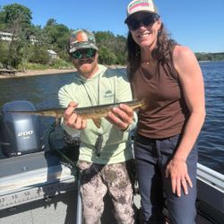 Fishing guide and client displaying caught Shortnose Gar on boat in Stillwater MN