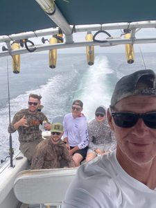 Four friends enjoying fishing in Pensacola
