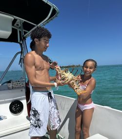 Two people fishing in the waters of Nassau