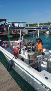 Five people fishing in the beautiful waters of Nassau