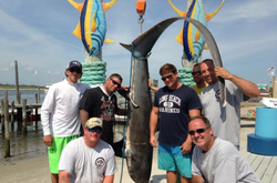 7 people fishing in Freeport with a 54-inch fish