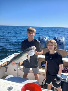 A man and a woman fishing at Pensacola Beach