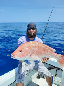 A person fishing in the water in FL