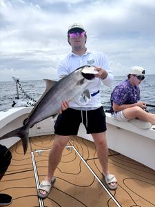 A Greater Amberjack fish caught by 4 people at Pensacola Beach