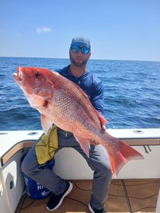 A person fishing at Pensacola Beach