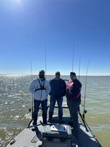 Three people fishing at Port Mansfield