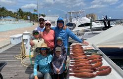 Group of 7 people enjoying fishing trip in Riviera Beach