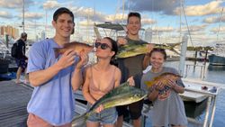 4 fishing rods and 5 people on the Riviera Beach coastline