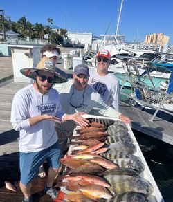 A group of 4 people fishing at Riviera Beach