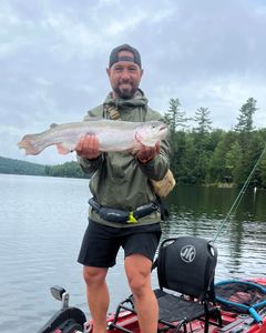 Angler with rainbow trout caught in NY