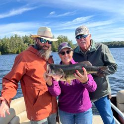 Three people enjoying a fishing trip in NY