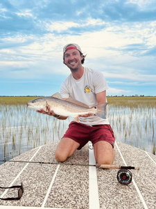 Angler with a large redfish catch in Brunswick
