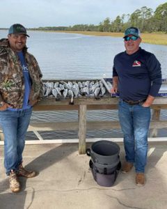 Two people fishing in Brunswick