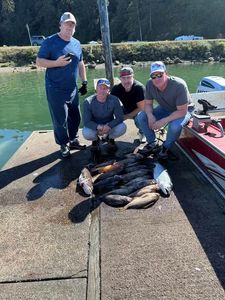 Four people enjoying a fishing trip in OR