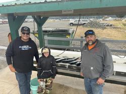 Three people enjoying fishing at Myrtle Creek